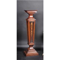A late Victorian rosewood pedestal, the square top supported on a marquetry inlaid square section t.