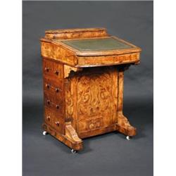 A Victorian walnut Davenport desk, the cushion moulded stationery box above a rising leather lined..