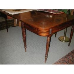 A 19th century mahogany dining table, the rounded rectangular top above a plain frieze supported on.