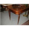 Image 1 : A 19th century mahogany dining table, the rounded rectangular top above a plain frieze supported on.