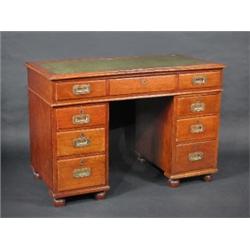 A 19th century mahogany campaign pedestal desk, the moulded rectangular leather inset top above a l.