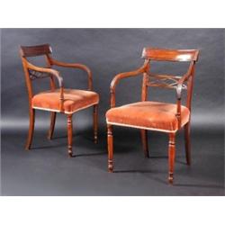 A set of six Regency style mahogany dining chairs, including two carvers, each with panelled top ra.