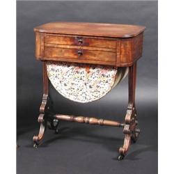 A Regency mahogany work table, the rounded rectangular top with reeded edge above a pair of frieze..