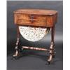 Image 1 : A Regency mahogany work table, the rounded rectangular top with reeded edge above a pair of frieze..