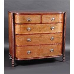 A 19th century mahogany bow front chest, the shaped top with reeded edge above two short and three..