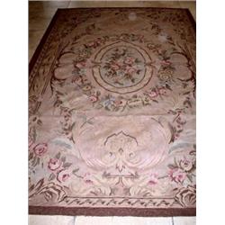 An Aubusson style needlepoint carpet, with all over scrolling floral design, 244 x 152cm   £300-500.