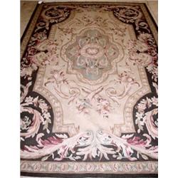 An Aubusson style needlepoint carpet, with all over scrolling floral design, 244 x 152cm   £300-500.