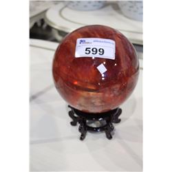 RED GLASS ORB ON STAND