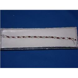 BRACELET - 6.0 CTW (12) OVAL FACETED GARNET & DIAMOND IN STERLING SILVER FIGURE 8 DESIGNED SETTING -