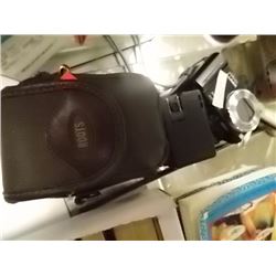 LUMIX CAMERA IN ROOTS CASE