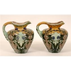 A Pair of Dutch Jugs, decorated thistles, 20 cm (2) See illustration