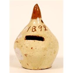 A Bideford Pottery Money Box, in the form of an onion, dated 1892, 11.5 cm See illustration