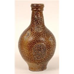 A 17th Century Bellamine, with bearded face mask and star shaped medallion, 23 cm See illustration