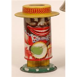 A Watch Me Grow Money Tin, modelled as a black man playing a banjo, 14 cm See illustration