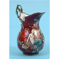 A Continental Gilt Metal and Enamel Jug, decorated fairies and cherubs, on a red ground, 8 cm See c