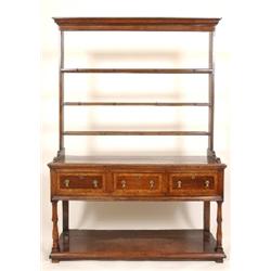 A George II Style Oak Dresser, the open plate rack above three frieze drawers, on turned legs with a