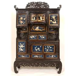 A Japanese Display Cabinet on Stand, the lacquered panels inlaid with mother of pearl and ivory, dec