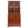 Image 1 : A Mahogany Bookcase on Cupboard, with a pair of glazed doors above a frieze drawer, with cupboard be
