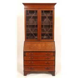 An Edwardian Mahogany Bureau Bookcase, the pair of astragal glazed doors above a fall front inlaid w