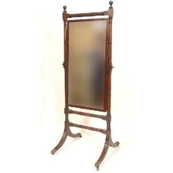 A 19th Century Mahogany Cheval Mirror, with turned columns, on reeded splay legs, and lion claw feet