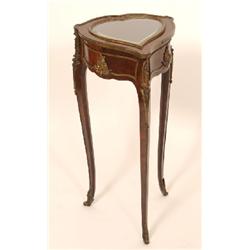 A 19th Century French Rosewood Work Table, the heart shape top with inset bevel glass, on swept legs