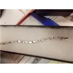 BRACELET - 12 OVAL FACETED BLUE TOPAZ & DIAMOND IN STERLING SILVER CROSS OVER LINK DESIGNED SETTING 