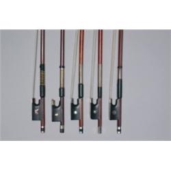 A SILVER MOUNTED GERMAN VIOLIN BOW, NURNBERGER WORKSHOP, the octagonal stick of chestnut brown co...