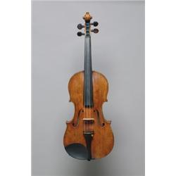AN ITALIAN VIOLIN, bearing a label of Vincenzo Panormo, the two piece back of bold figure descend...