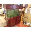 Image 1 : FISH TANK AND STAND - ~90 GAL TANK WITH PUMP, PLANTS, FOOD & MORE - INCLUDED FLUVAL CANISTER FILTER 
