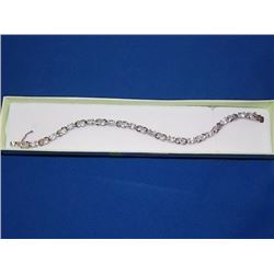 BRACELET - 12 OVAL FACETED WHITE TOPAZ & DIAMOND IN STERLING SILVER INFINITY LINK DESIGNED SETTING -