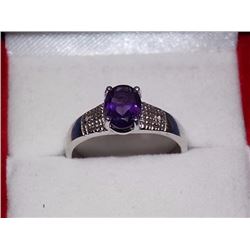 RING - OVAL FACETED 1.5CT AMETHYST & 2 DIAMOND RING IN STERLING SILVER SETTING - RETAIL ESTIMATE $35