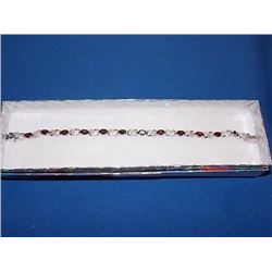 BRACELET - 6.0 CTW (12) OVAL FACETED GARNET & DIAMOND IN STERLING SILVER FIGURE 8 DESIGNED SETTING -