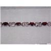 Image 2 : BRACELET - 6.0 CTW (12) OVAL FACETED GARNET & DIAMOND IN STERLING SILVER FIGURE 8 DESIGNED SETTING -