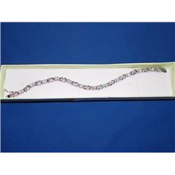 BRACELET - 12 OVAL FACETED WHITE TOPAZ & DIAMOND IN STERLING SILVER INFINITY LINK DESIGNED SETTING -