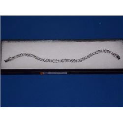 BRACELET - 6CTW (12) LIVELY BLUE TOPAZS & DIAMOND IN STERLING SILVER CROSS OVER LINK DESIGN SETTING 
