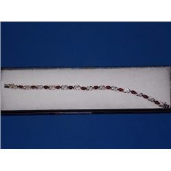 BRACELET - 6CTW (12)OVAL FACETED GARNET & DIAMOND IN STERLING SILVER INFINITY DESIGNED SETTING - RET