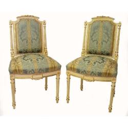PAIR OF LOUIS XVI STYLE PAINTED AND GILTWOOD SIDE CHAIRS, Each leaf carved top rail above a pad...