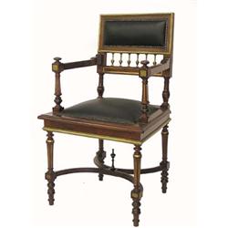EMPIRE STYLE GILT BRONZE MOUNTED MAHOGANY ARM CHAIR, The rectangular padded backrest above vase...