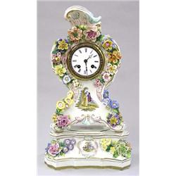 DRESDEN PORCELAIN CLOCK AND STAND, German. Late 19th Century. Circular dial with Roman numerals...