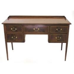 GEORGIAN STYLE INLAID MAHOGANY DESK, The rectangular top with a quarter gallery above five draw...