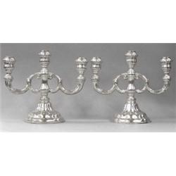 PAIR OF CONTINENTAL SILVER THREE LIGHT CANDELABRA, German. Circa 1900-1910. Each circular base...