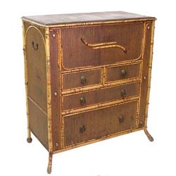 BAMBOO AND WICKER CHEST, American. Circa 1900. The rectangular top hinged to open to a well abo...