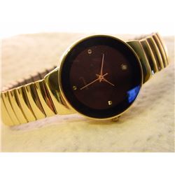 NEW GOLD TONE DIAMOND KING WATCH, GENUINE DIAMOND SET AT 12 O'CLOCK - SUGGESTED RETAIL  $400