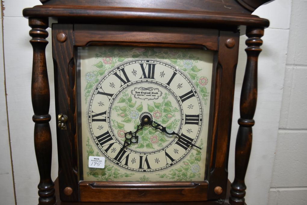 Weight driven wall hanging chiming clock made by New England Clock
