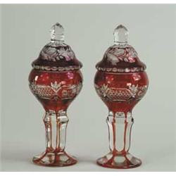 PAIR OF BOHEMIAN OVERLAY RUBY GLASS POKALS WITH COVERS