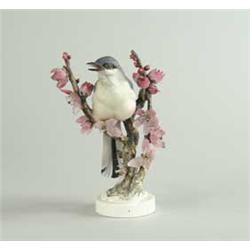 ROYAL WORCESTER PORCELAIN MOCKINGBIRD WITH PEACH BLOSSOM MODELED BY DOROTHY DOUGHTY