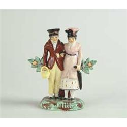 STAFFORDSHIRE FIGURAL GROUP OF MAN AND WOMAN