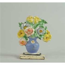 CAST IRON VASE OF FLOWER DOORSTOP