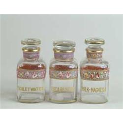 THREE DECORATED TOILETRY BOTTLES