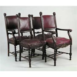 SET OF FOUR DINING CHAIRS WITH CARVED HEADS